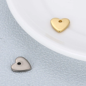 Minimalist heart-shaped stainless steel beads in gold and silver for DIY jewelry