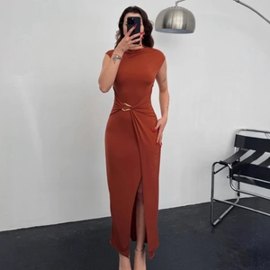 Sleeveless caramel knit maxi dress with turtleneck and gold metal waist ring detail