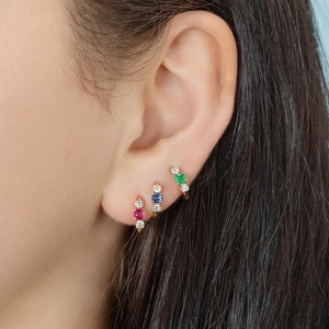 Three-piece set of gold huggie hoop earrings with red, blue and green zircon stones