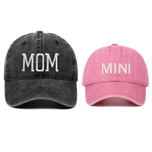 Close-up of MOM and MINI embroidered letters on washed cotton parent-child baseball caps