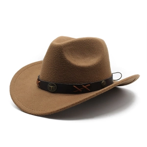 Classic brown felt western cowboy hat with a leather band and vintage bull head metal ornament