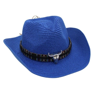 Detail of royal blue straw cowboy hat with ethnic band and silver bull skull ornament