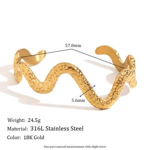 18K gold plated stainless steel wavy cuff bracelet featuring hammered texture details