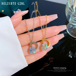 Minimalist D-letter pendant necklace in gold and silver finish with crystal stones