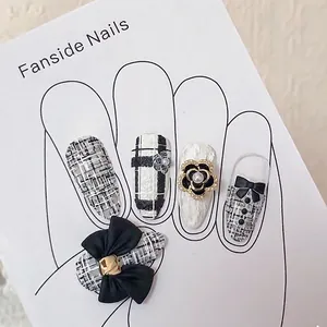 Elegant tweed nail art press-ons with 3D bows, camellia flowers and pearls