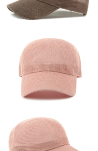 Detail of pink and khaki knitted hollow baseball caps showing breathable mesh texture