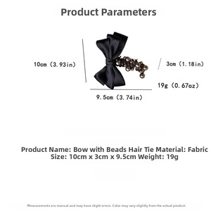 Detailed size measurement of black fabric bow hair tie with bead on white background