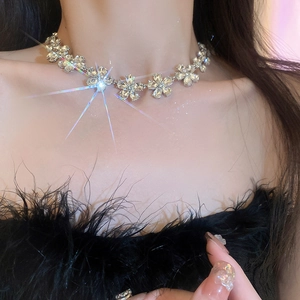 Close-up of sparkling crystal flower choker necklace showing intricate petal details