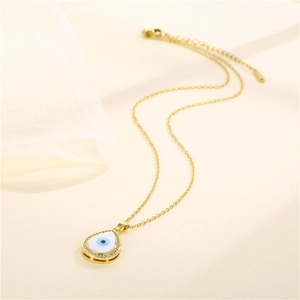 Teardrop evil eye pendant necklace with blue zircon and pavé crystals on silk