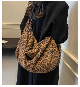 Detail shot of a large leopard print hobo shoulder bag with a soft plush velvet texture