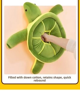 Macro view of plush sea turtle pillow being pressed to show fast rebound down cotton fill