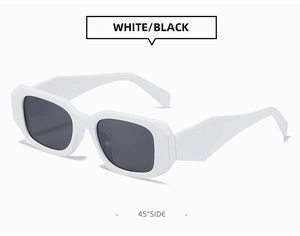 Detail view of bold white square frame sunglasses with dark lenses from 45-degree angle
