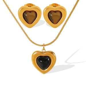 Minimalist gold heart jewelry set featuring black and tiger eye stone pendants
