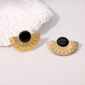 Vintage geometric fan-shaped gold earrings with black gemstone in white coral setting