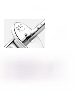 Detailed close-up of S925 sterling silver hallmark and black moissanite halo earring