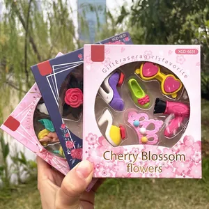 Close-up of cute cartoon stationery erasers in high-heel and crown shapes for girls