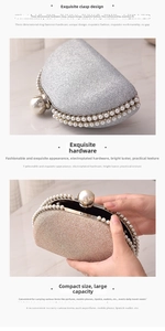 Detailed view of luxury pearled clasp and glitter surface on semi-circular evening clutch