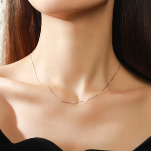 Elegant silver S925 sterling silver heart snake chain necklace on model neck
