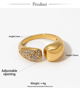 Detail view of adjustable gold-plated ring with smooth pebble design and cubic zirconia pavé