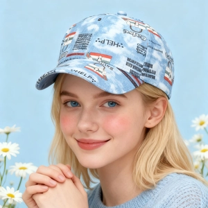 Close-up of light blue tie-dye baseball cap with street graffiti prints on model
