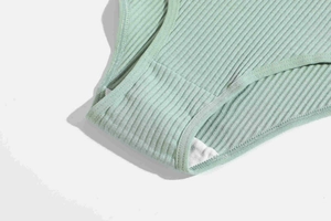 Detail view of ribbed cotton panties showing breathable lining and reinforced stitching