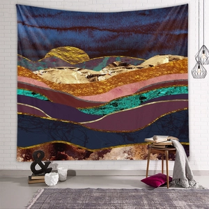 Detail view of abstract mountain sunset tapestry hanging on white brick wall with decor