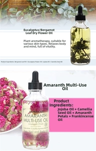 Detail showing 120ml botanical oils with dried flowers for hair, nail and body care