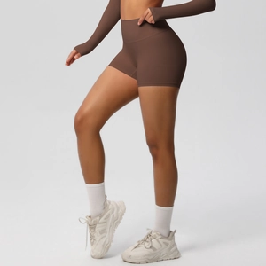 Women's brown high-waisted yoga shorts and long sleeve top set for fitness