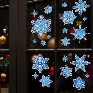 Blue Christmas snowflake window decals with holographic finish on glass background