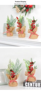 Detail view of mini artificial Christmas trees with red berries and rustic burlap bases