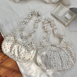 Close-up of floral tote bags featuring lace trim, ruffled straps and rose patterns