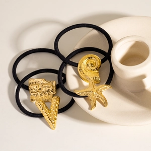 Set of 3 black elastic hair ties featuring gold starfish, conch, and geometric charms