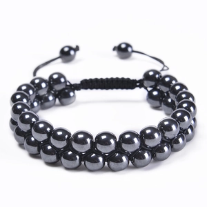 Detail of 10mm tiger eye stone double-layer bracelet with adjustable braided black cord