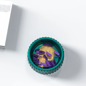 Macro detail of skull craft resin mold with purple faith charms and gold skull decor
