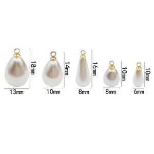 Five teardrop pearl pendants in different sizes with metal rings for jewelry making