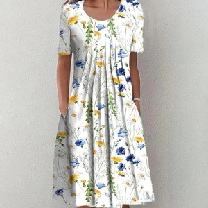 Detail of floral summer dress with side pockets and a vintage blue flower pattern