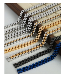 Detailed close-up of multi-color presidential style link chain bracelets in titanium steel