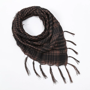 Detail showing the woven checkered texture and handmade tassel fringe of the tactical scarf