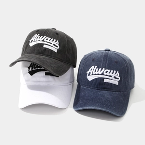 Detailed view of washed cotton baseball caps with 3D Always embroidery in three colors