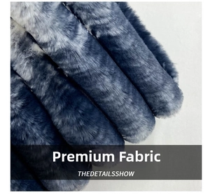 Close-up of fluffy faux fur texture in gradient dark blue and light grey faux fur material