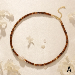 Tiger eye beaded necklace with a large white baroque pearl and golden lobster clasp detail