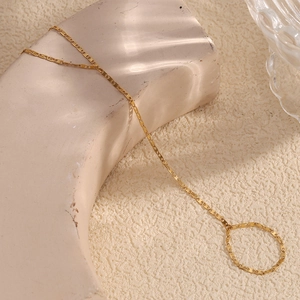 Detail of 18K gold-plated stainless steel hand chain with minimalist link bracelet design
