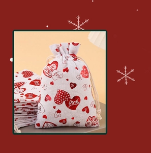 Detailed macro view of linen wedding candy bag with red heart pattern and Love text
