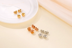 Detailed set of round ball stud earrings in gold, rose gold, and silver stainless steel