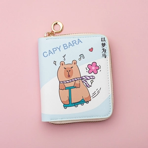Close-up of blue PU leather mini wallet featuring cartoon capybara on a scooter
