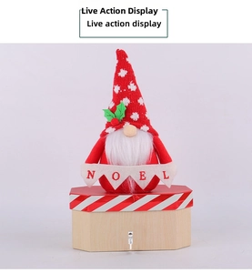 Macro detail of Christmas Gnome figure on an octagonal wooden box with Noel banner text