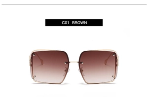 Detail view of square metal sunglasses with C01 brown gradient lenses and gold frames