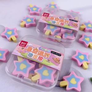 Close-up of colorful star-shaped lollipop erasers in cute pink and blue stationery gift boxes