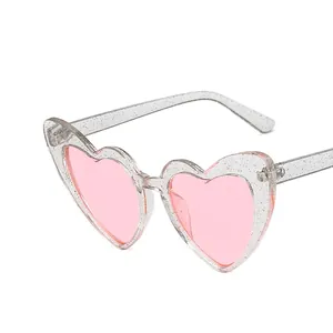 Fashionable heart-shaped sunglasses with pink lenses and silver glitter transparent frame