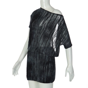 Detail of black cut-out mini dress featuring sheer mesh texture and one-shoulder strap